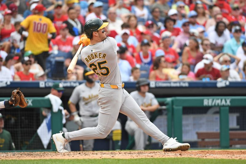 Jul 14, 2024; Philadelphia, Pennsylvania, USA; Oakland Athletics outfielder Brent Rooker (25) hits a two-run home run against the Philadelphia Phillies during the sixth inning at Citizens Bank Park. Mandatory Credit: Eric Hartline-USA TODAY Sports