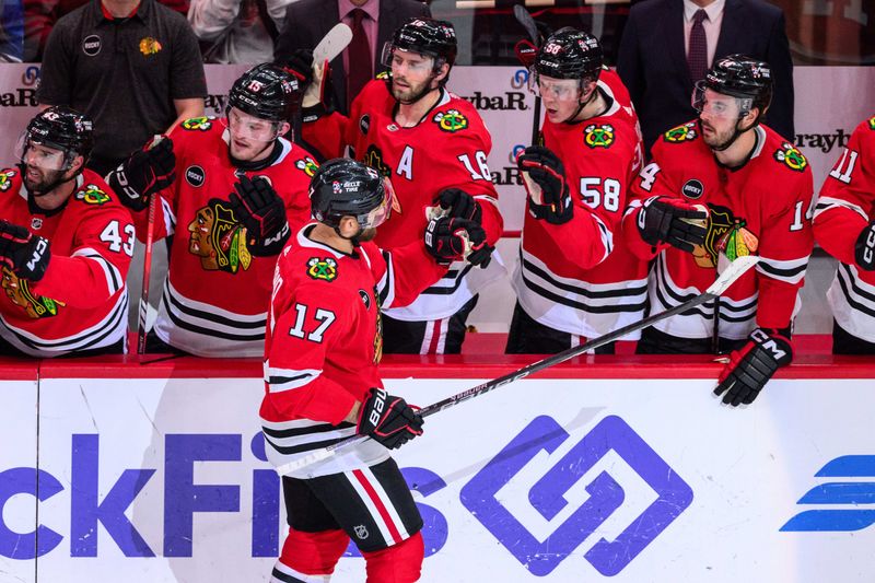 Feb 9, 2024; Chicago, Illinois, USA; Chicago Blackhawks left wing Nick Foligno (17) celebrates his goal with teammates against the New York Rangers during the third period at the United Center. Mandatory Credit: Daniel Bartel-USA TODAY Sports