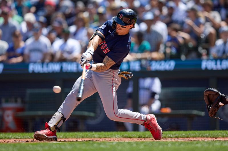 Aug 2, 2023; Seattle, Washington, USA; Boston Red Sox player Jarren Duran hits a two-run home run against the Seattle Mariners during the third inning at T-Mobile Park. Mandatory Credit: John Froschauer-USA TODAY Sports