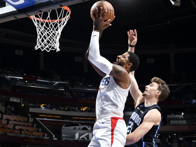 ORLANDO, FL - DECEMBER 7: Paul George #13 of the LA Clippers shoots the ball during the game against the Orlando Magic on December 7, 2022 at Amway Center in Orlando, Florida. NOTE TO USER: User expressly acknowledges and agrees that, by downloading and or using this photograph, User is consenting to the terms and conditions of the Getty Images License Agreement. Mandatory Copyright Notice: Copyright 2022 NBAE (Photo by Fernando Medina/NBAE via Getty Images)