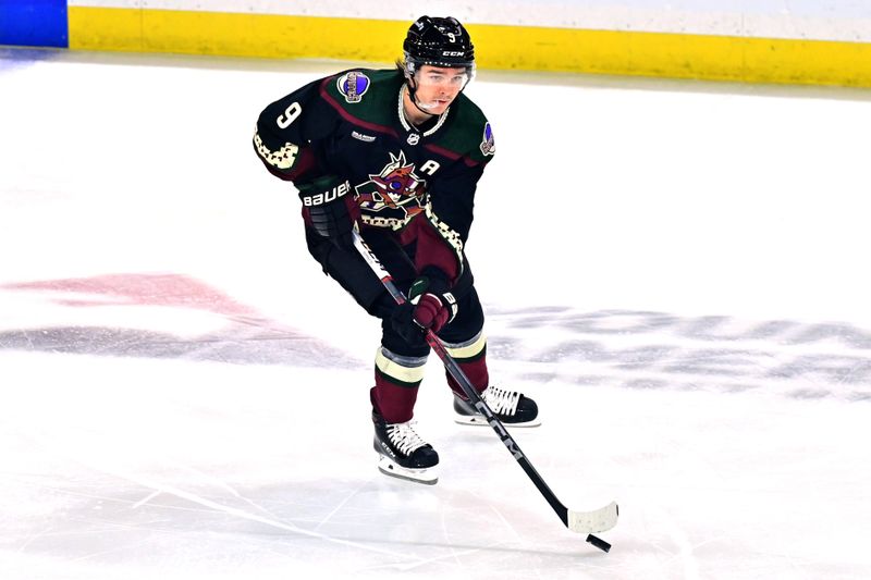 Dec 19, 2023; Tempe, Arizona, USA; Arizona Coyotes right wing Clayton Keller (9) carries the puck in the first period against the Ottawa Senators at Mullett Arena. Mandatory Credit: Matt Kartozian-USA TODAY Sports