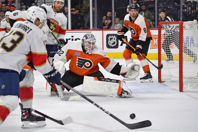Mar 24, 2024; Philadelphia, Pennsylvania, USA; Philadelphia Flyers goaltender Felix Sandstrom (32) defends as Florida Panthers center Sam Reinhart (13) reaches for the puck during the second period at Wells Fargo Center. Mandatory Credit: Eric Hartline-USA TODAY Sports