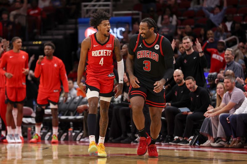 HOUSTON, TEXAS - MARCH 21: Jalen Green #4 of the Houston Rockets reacts after a three point basket defended by Andre Drummond #3 of the Chicago Bulls in the second half at Toyota Center on March 21, 2024 in Houston, Texas.  NOTE TO USER: User expressly acknowledges and agrees that, by downloading and or using this photograph, User is consenting to the terms and conditions of the Getty Images License Agreement. (Photo by Tim Warner/Getty Images)