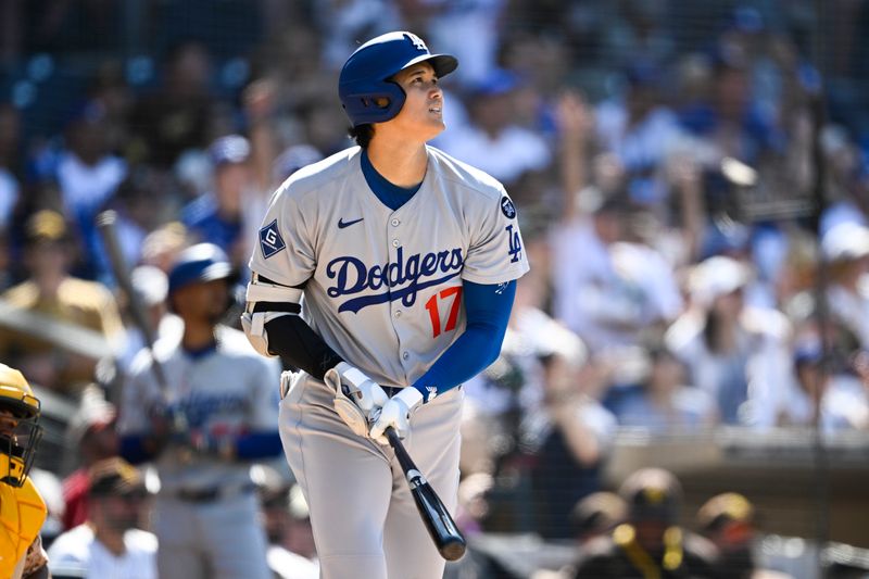 Aug 24, 2025; San Diego, California, USA; Los Angeles Dodgers designated hitter Shohei Ohtani (17) hits a solo home run during the ninth inning against the San Diego Padres at Petco Park. Mandatory Credit: Denis Poroy-Imagn Images