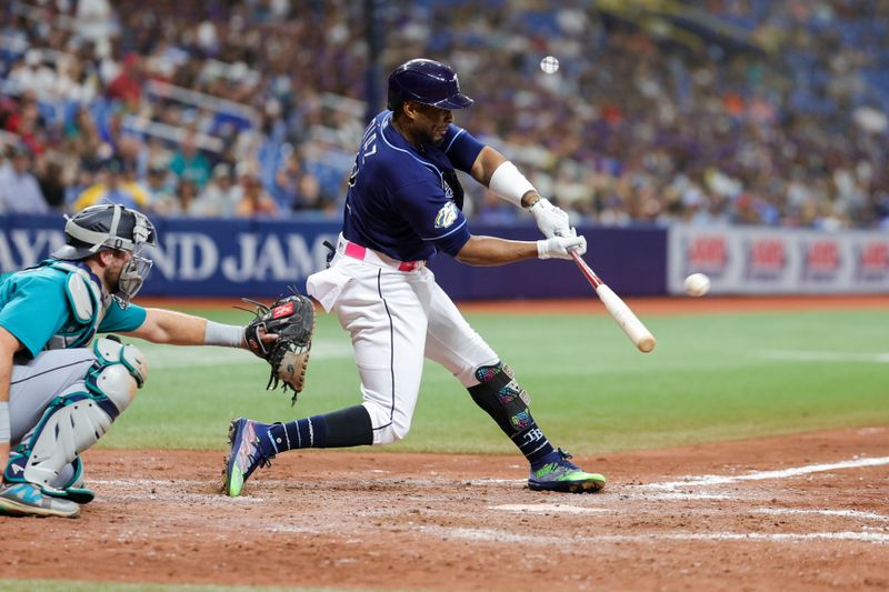 Sep 9, 2023; St. Petersburg, Florida, USA;  Tampa Bay Rays first baseman Yandy Diaz (2) hits a walk off two-run home run against the Seattle Mariners in the ninth inning at Tropicana Field. Mandatory Credit: Nathan Ray Seebeck-USA TODAY Sports