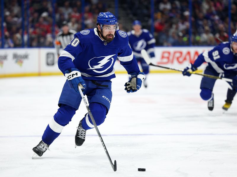 Feb 22, 2024; Tampa, Florida, USA;  Tampa Bay Lightning left wing Nicholas Paul (20) controls the puck against the Washington Capitals in the third period at Amalie Arena. Mandatory Credit: Nathan Ray Seebeck-USA TODAY Sports