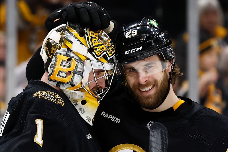 Jan 22, 2024; Boston, Massachusetts, USA; Boston Bruins defenseman Parker Wotherspoon (29) congratulates goaltender Jeremy Swayman (1) after their 4-1 win over the Winnipeg Jets at TD Garden. Mandatory Credit: Winslow Townson-USA TODAY Sports