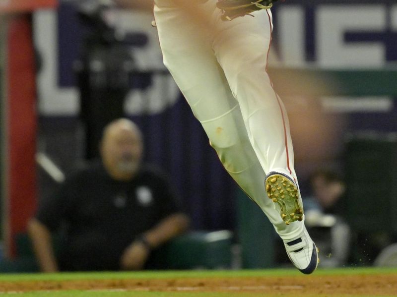 May 26, 2025; Anaheim, California, USA;  Los Angeles Angels third baseman Yoan Moncada (5) throws New York Yankees shortstop Anthony Volpe (11) out at first in the sixth inning at Angel Stadium. Mandatory Credit: Jayne Kamin-Oncea-Imagn Images