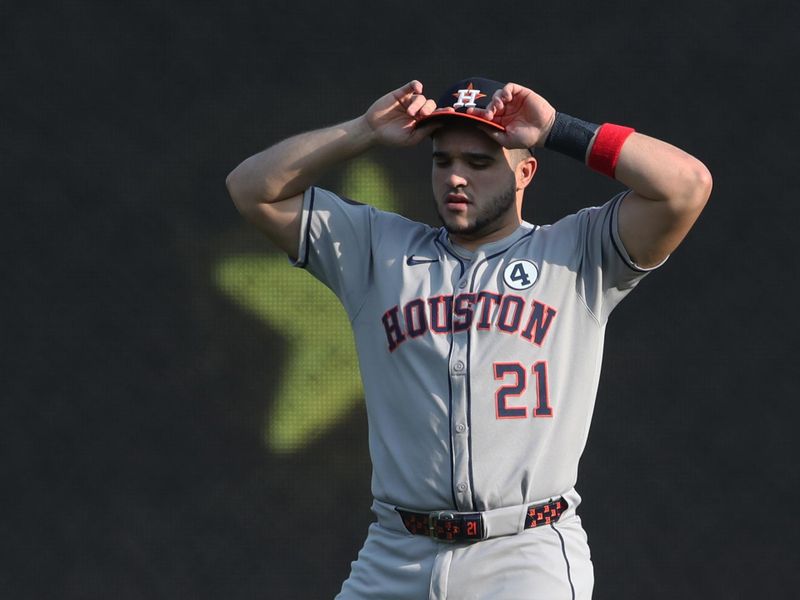 Jun 3, 2025; Pittsburgh, Pennsylvania, USA;  Houston Astros designated hitter Yainer Diaz (21) warms up in the outfield before the game against the Pittsburgh Pirates at PNC Park. Mandatory Credit: Charles LeClaire-Imagn Images