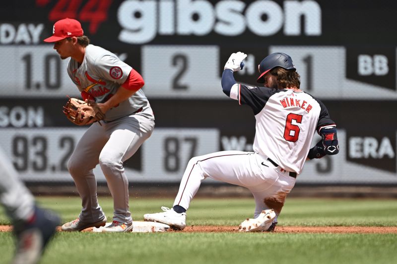 Jul 7, 2024; Washington, District of Columbia, USA; Washington Nationals left fielder Jesse Winker (6) slides into second base in front of St. Louis Cardinals second baseman Nolan Gorman (16) during the second inning at Nationals Park. Mandatory Credit: Rafael Suanes-USA TODAY Sports