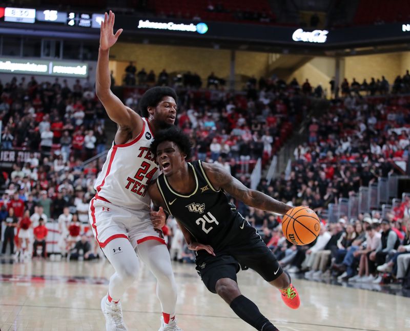 Feb 10, 2024; Lubbock, Texas, USA; Central Florida Knights guard Jaylin Sellers (24) drives to the basket against Texas Tech Red Raiders guard Kerwin Walton (24) in the first half United Supermarkets Arena. Mandatory Credit: Michael C. Johnson-USA TODAY Sports