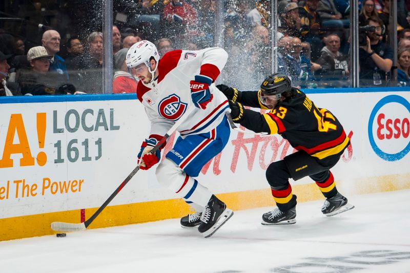 Oct 25, 2025; Vancouver, British Columbia, CAN; Vancouver Canucks defenseman Quinn Hughes (43) checks Montreal Canadiens forward Josh Anderson (17) in the first period at Rogers Arena. Mandatory Credit: Bob Frid-Imagn Images