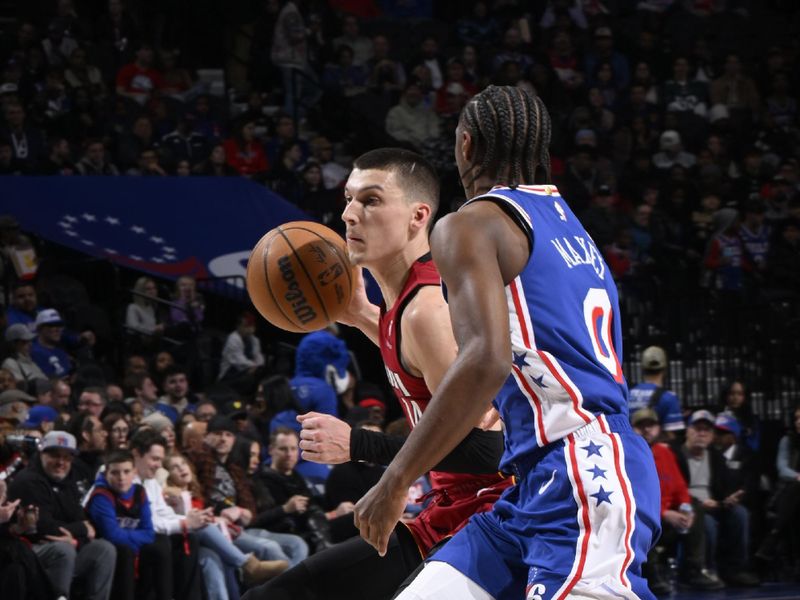 PHILADELPHIA, PA - FEBRUARY 5: Tyler Herro #14 of the Miami Heat dribbles the ball during the game against the Philadelphia 76ers on February 5, 2025 at the Wells Fargo Center in Philadelphia, Pennsylvania NOTE TO USER: User expressly acknowledges and agrees that, by downloading and/or using this Photograph, user is consenting to the terms and conditions of the Getty Images License Agreement. Mandatory Copyright Notice: Copyright 2025 NBAE (Photo by David Dow/NBAE via Getty Images)