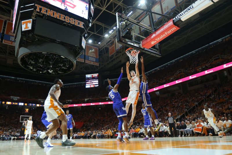 Jan 28, 2025; Knoxville, Tennessee, USA; Tennessee Volunteers forward Igor Milicic Jr. (7) goes to the basket against the Kentucky Wildcats during the second half at Thompson-Boling Arena at Food City Center. Mandatory Credit: Randy Sartin-Imagn Images