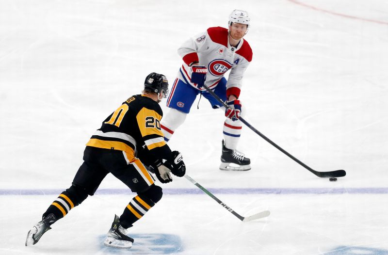 Jan 27, 2024; Pittsburgh, Pennsylvania, USA;  Montreal Canadiens defenseman Mike Matheson (8) moves the puck against Pittsburgh Penguins center Lars Eller (20) during the first period at PPG Paints Arena. Mandatory Credit: Charles LeClaire-USA TODAY Sports