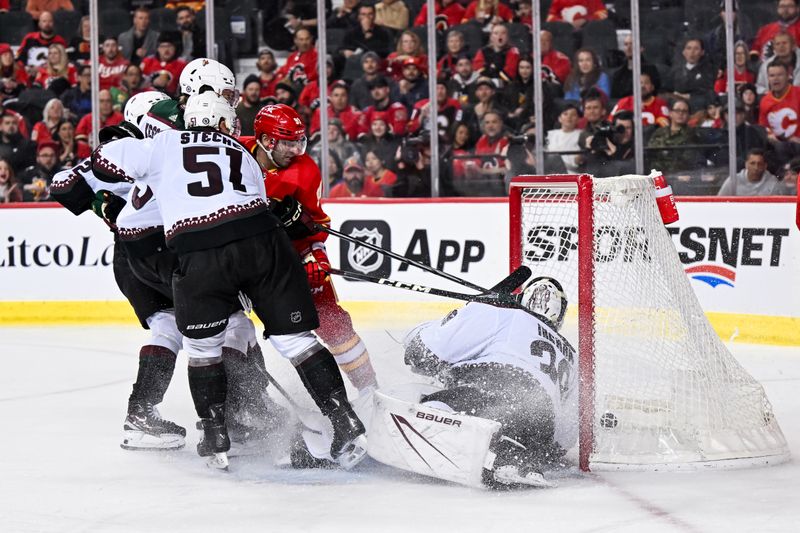 Jan 16, 2024; Calgary, Alberta, CAN; Calgary Flames center Nazem Kadri (91) scores a goal against Arizona Coyotes goaltender Connor Ingram (39) during the third period at Scotiabank Saddledome. Mandatory Credit: Brett Holmes-USA TODAY Sports