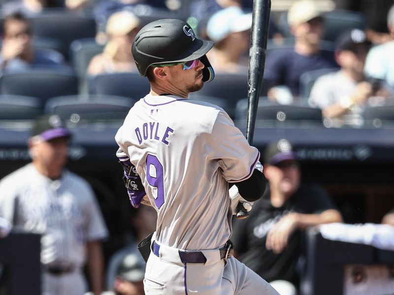 Aug 24, 2024; Bronx, New York, USA;  Colorado Rockies center fielder Brenton Doyle (9) hits an RBI single in the third inning against the New York Yankees at Yankee Stadium. Mandatory Credit: Wendell Cruz-USA TODAY Sports