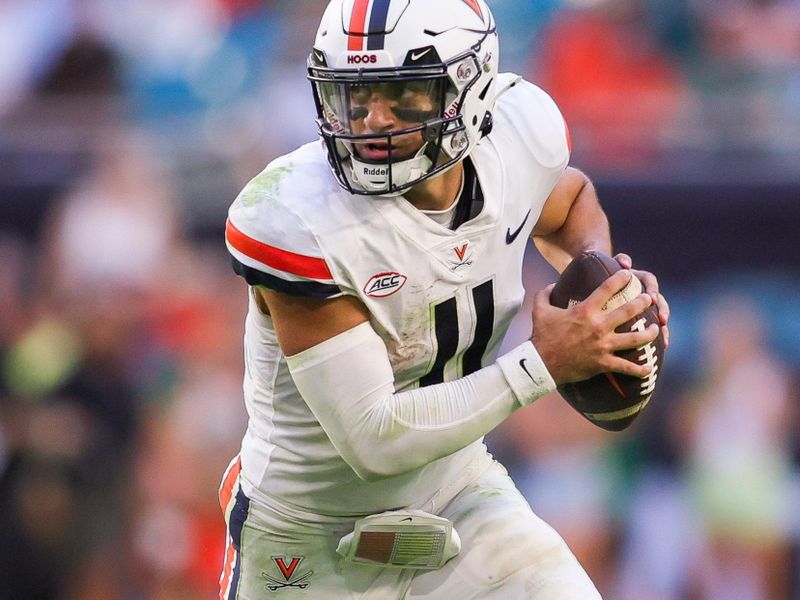 Oct 28, 2023; Miami Gardens, Florida, USA; Virginia Cavaliers quarterback Tony Muskett (11) runs with the ball against the Miami Hurricanes during the fourth quarter at Hard Rock Stadium. Mandatory Credit: Sam Navarro-USA TODAY Sports