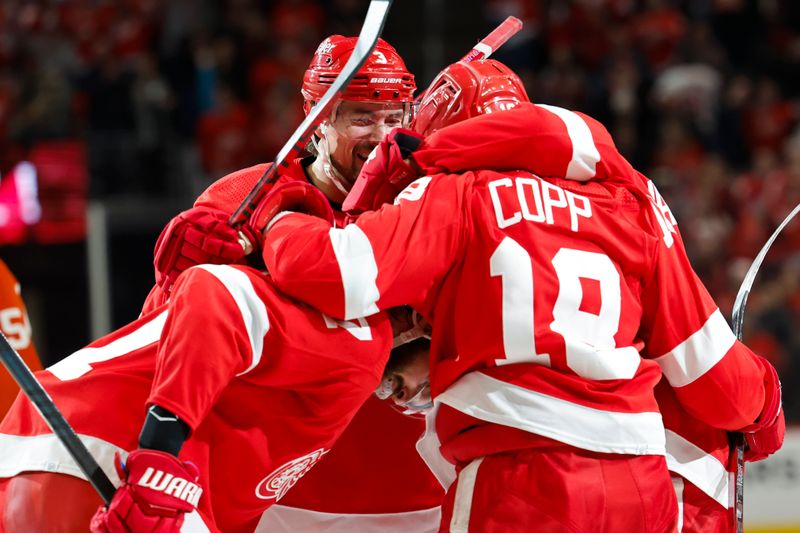 Jan 25, 2024; Detroit, Michigan, USA;  Detroit Red Wings center Andrew Copp (18) receives congratulations from teammates after scoring in the second period against the Philadelphia Flyers at Little Caesars Arena. Mandatory Credit: Rick Osentoski-USA TODAY Sports