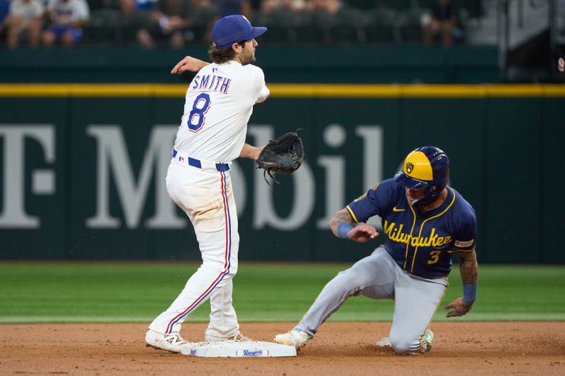 Sep 10, 2025; Arlington, Texas, USA; Texas Rangers shortstop Josh Smith (8) throws to first after forcing out Milwaukee Brewers shortstop Joey Ortiz (3) during the third inning at Globe Life Field. Mandatory Credit: Jim Cowsert-Imagn Images