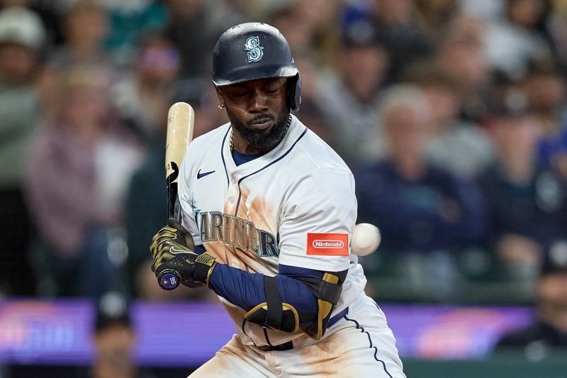 May 14, 2025; Seattle, Washington, USA; Seattle Mariners left fielder Randy Arozarena (56) is hit by a pitch from New York Yankees pitcher Fernando Cruz (not pictured) during the eighth inning at T-Mobile Park. Mandatory Credit: John Froschauer-Imagn Images