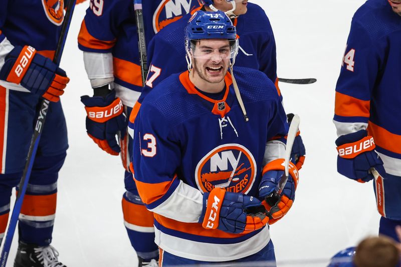 Apr 27, 2024; Elmont, New York, USA; New York Islanders center Mathew Barzal (13) skates off the ice after scoring the game winning goal in the second overtime against the Carolina Hurricanes in game four of the first round of the 2024 Stanley Cup Playoffs at UBS Arena. Mandatory Credit: Wendell Cruz-USA TODAY Sports