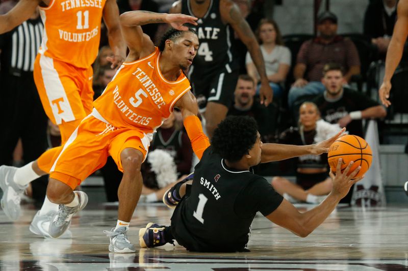 Jan 17, 2023; Starkville, Mississippi, USA; Mississippi State Bulldogs forward Tolu Smith (1) passes the ball as Tennessee Volunteers guard Zakai Zeigler (5) defends during the first half at Humphrey Coliseum. Mandatory Credit: Petre Thomas-USA TODAY Sports