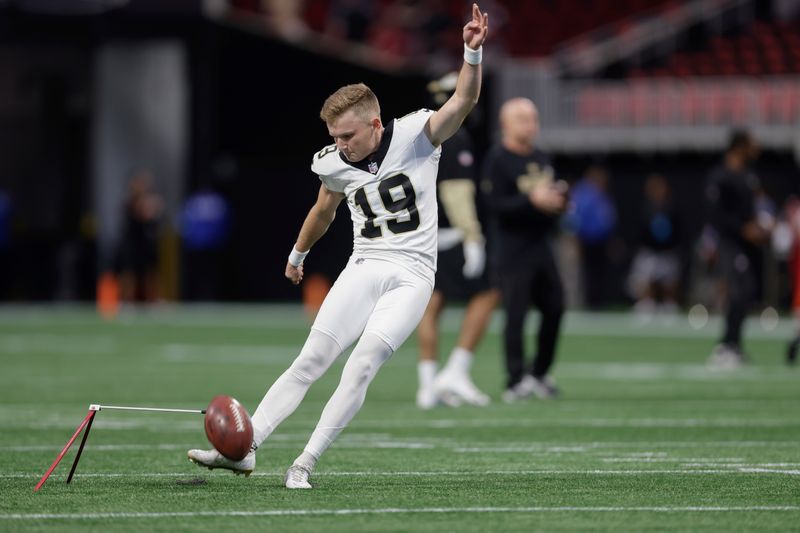 New Orleans Saints kicker Blake Grupe (19) warms up prior to an NFL football game against the Atlanta Falcons, Sunday, Sept. 29, 2024, in Atlanta. (AP Photo/Stew Milne)