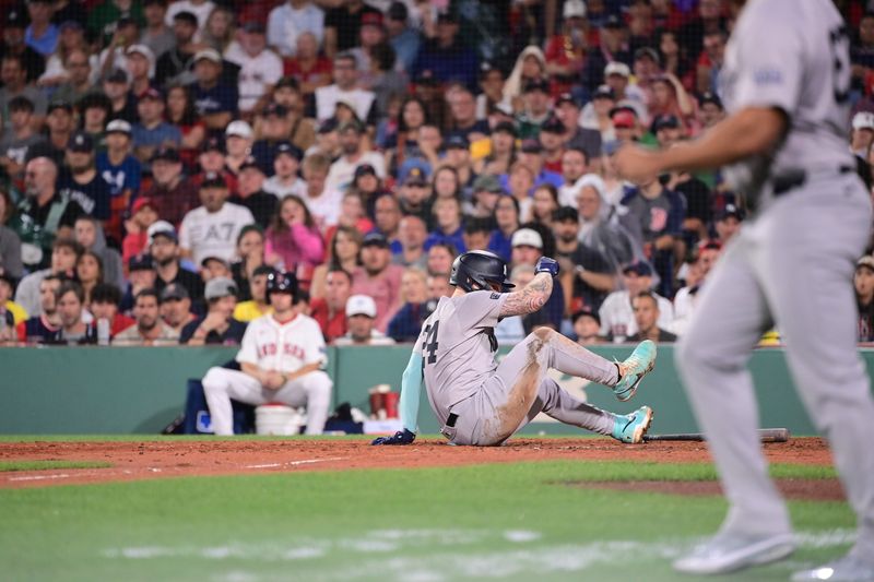 Jul 28, 2024; Boston, Massachusetts, USA; Boston Red Sox designated hitter Danny Jensen (28) dives for third base during the seventh inning against the New York Yankees at Fenway Park. Mandatory Credit: Eric Canha-USA TODAY Sports