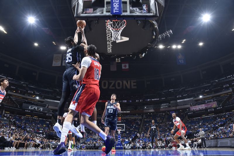 ORLANDO, FL - NOVMEBER 10: Goga Bitadze #35 of the Orlando Magic drives to the basket during the game against the Washington Wizards on November 10, 2024 at Kia Center in Orlando, Florida. NOTE TO USER: User expressly acknowledges and agrees that, by downloading and or using this photograph, User is consenting to the terms and conditions of the Getty Images License Agreement. Mandatory Copyright Notice: Copyright 2024 NBAE (Photo by Fernando Medina/NBAE via Getty Images)