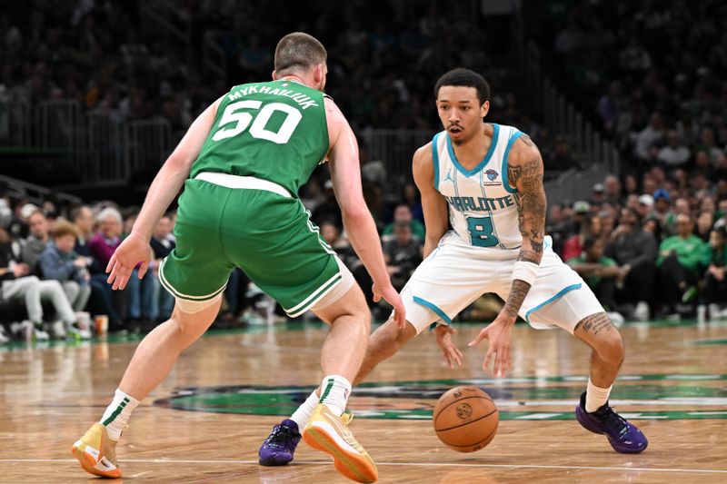 BOSTON, MASSACHUSETTS - APRIL 12: Nick Smith Jr. #8 of the Charlotte Hornets dribbles the ball against Svi Mykhailiuk #50 of the Boston Celtics during the third quarter at the TD Garden on April 12, 2024 in Boston, Massachusetts. NOTE TO USER: User expressly acknowledges and agrees that, by downloading and or using this photograph, User is consenting to the terms and conditions of the Getty Images License Agreement. (Photo by Brian Fluharty/Getty Images)