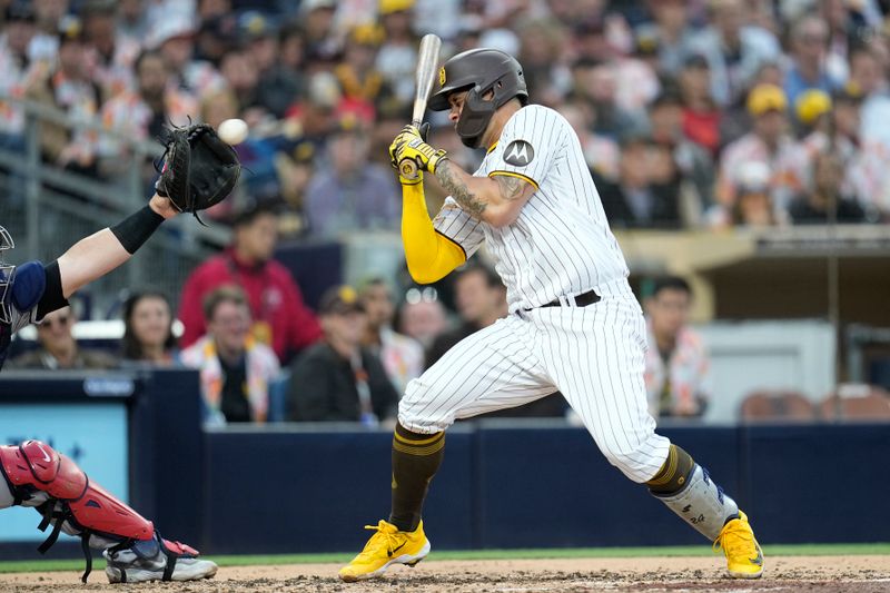 Jun 14, 2023; San Diego, California, USA;  San Diego Padres catcher Gary Sanchez (99) reacts to an inside pitch during the third inning against the Cleveland Guardians at Petco Park. Mandatory Credit: Ray Acevedo-USA TODAY Sports