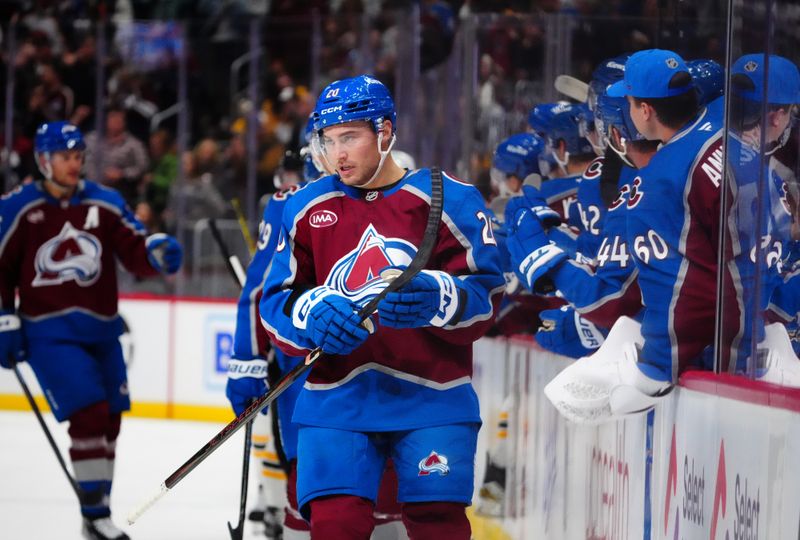 Oct 16, 2024; Denver, Colorado, USA; Colorado Avalanche center Ross Colton (20) celebrates a goal in the first period against the Boston Bruins at Ball Arena. Mandatory Credit: Ron Chenoy-Imagn Images