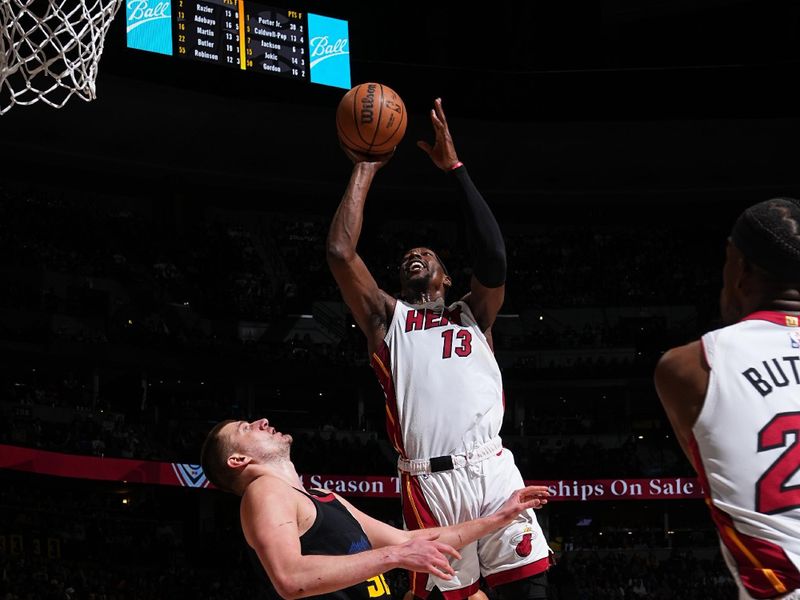 DENVER, CO - FEBRUARY 29: Bam Adebayo #13 of the Miami Heat shoots the ball during the game against the Denver Nuggets on February 29, 2024 at the Ball Arena in Denver, Colorado. NOTE TO USER: User expressly acknowledges and agrees that, by downloading and/or using this Photograph, user is consenting to the terms and conditions of the Getty Images License Agreement. Mandatory Copyright Notice: Copyright 2024 NBAE (Photo by Garrett Ellwood/NBAE via Getty Images)