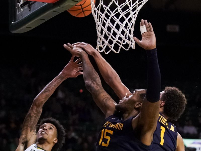 Feb 13, 2023; Waco, Texas, USA; Baylor Bears forward Jalen Bridges (11) shoots over  West Virginia Mountaineers forward Jimmy Bell Jr. (15) during the second half at Ferrell Center. Mandatory Credit: Raymond Carlin III-USA TODAY Sports