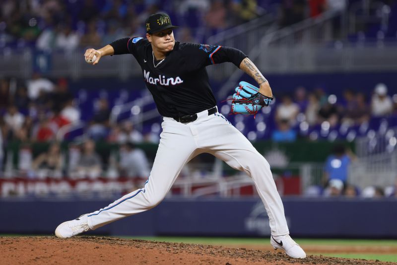 May 17, 2024; Miami, Florida, USA; Miami Marlins relief pitcher Anthony Maldonado (52) delivers a pitch against the New York Mets during the ninth inning at loanDepot Park. Mandatory Credit: Sam Navarro-USA TODAY Sports