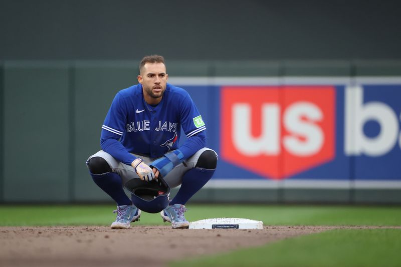 Oct 4, 2023; Minneapolis, Minnesota, USA; Toronto Blue Jays right fielder George Springer (4) looks on in the fifth inning against the Minnesota Twins during game two of the Wildcard series for the 2023 MLB playoffs at Target Field. Mandatory Credit: Jesse Johnson-USA TODAY Sports