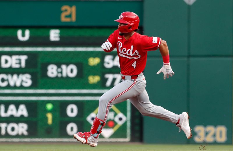 Aug 23, 2024; Pittsburgh, Pennsylvania, USA;  Cincinnati Reds third baseman Santiago Espinal (4) runs to second base with a double against the Pittsburgh Pirates during the third inning at PNC Park. Mandatory Credit: Charles LeClaire-USA TODAY Sports