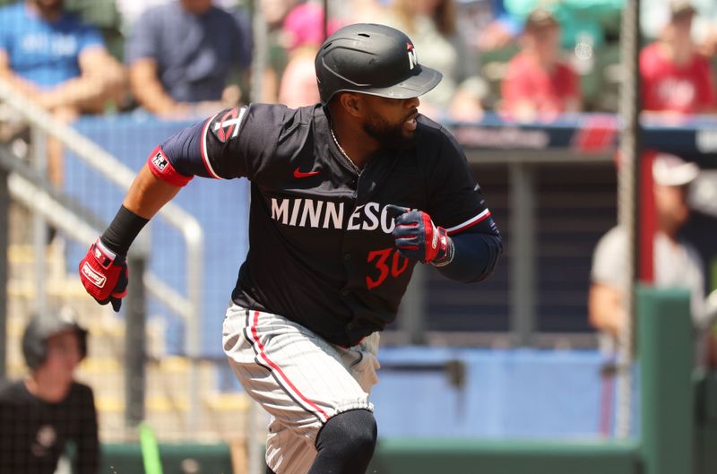 Mar 25, 2024; North Port, Florida, USA; Minnesota Twins shortstop Willie Castro (50) singles during the first inning against the Atlanta Braves at CoolToday Park. Mandatory Credit: Kim Klement Neitzel-USA TODAY Sports