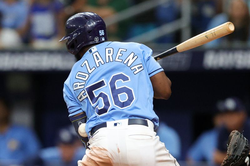 Aug 27, 2023; St. Petersburg, Florida, USA;  Tampa Bay Rays left fielder Randy Arozarena (56) is hit by a pitch against the New York Yankees in the eighth inning at Tropicana Field. Mandatory Credit: Nathan Ray Seebeck-USA TODAY Sports