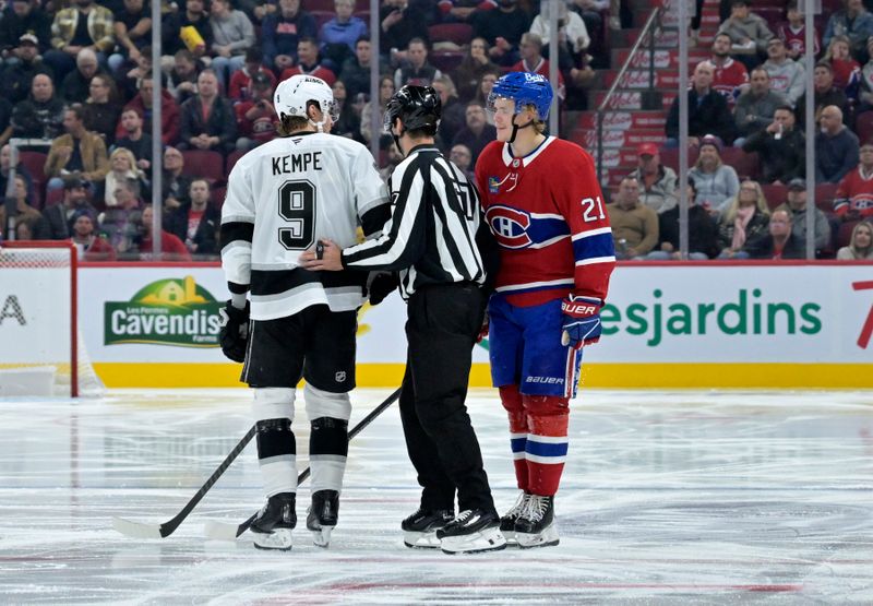 Oct 17, 2024; Montreal, Quebec, CAN; linesman Travis Gawryletz (67) seperates Los Angeles Kings forward Adrian Kempe (9) and Montreal Canadiens defenseman Kaiden Guhle (21) during the second period at the Bell Centre. Mandatory Credit: Eric Bolte-Imagn Images