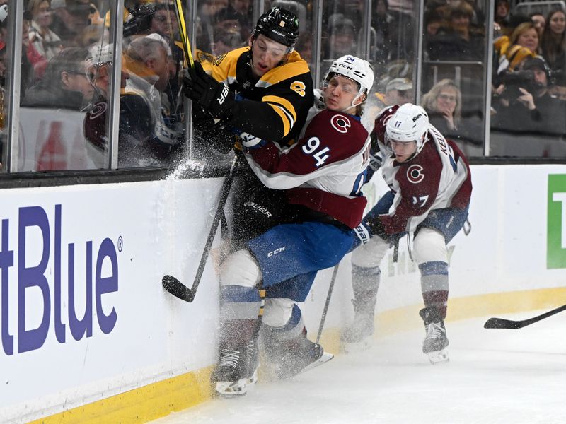 Jan 25, 2025; Boston, Massachusetts, USA; Colorado Avalanche left wing Joel Kiviranta (94) checks Boston Bruins defenseman Mason Lohrei (6) into the boards during the second period at the TD Garden. Mandatory Credit: Brian Fluharty-Imagn Images