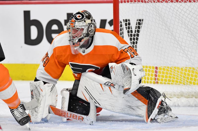 Oct 13, 2022; Philadelphia, Pennsylvania, USA; Philadelphia Flyers goaltender Carter Hart (79) follows the puck against the New Jersey Devils during the third period at Wells Fargo Center. Mandatory Credit: Eric Hartline-USA TODAY Sports