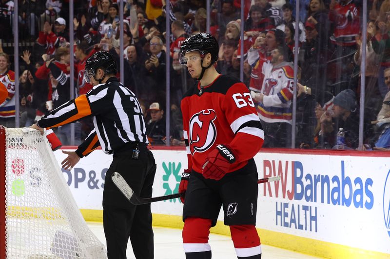 Dec 19, 2023; Newark, New Jersey, USA; New Jersey Devils left wing Jesper Bratt (63) reacts after his goal against the Philadelphia Flyers during the second period at Prudential Center. Mandatory Credit: Ed Mulholland-USA TODAY Sports