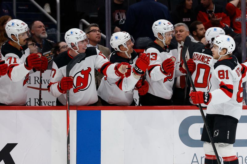 Nov 15, 2025; Washington, District of Columbia, USA; New Jersey Devils right wing Arseny Gritsyuk (81) celebrates with teammates after scoring a goal against the Washington Capitals during the first period at Capital One Arena. Mandatory Credit: Geoff Burke-Imagn Images