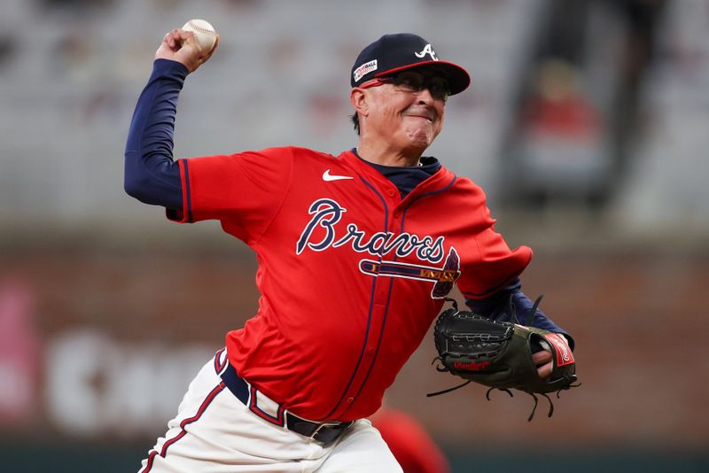 Jun 14, 2024; Atlanta, Georgia, USA; Atlanta Braves relief pitcher Jesse Chavez (60) throws against the Tampa Bay Rays in the eighth inning at Truist Park. Mandatory Credit: Brett Davis-USA TODAY Sports
