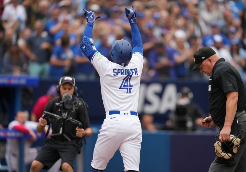 Sep 9, 2023; Toronto, Ontario, CAN; Toronto Blue Jays right fielder George Springer (4) celebrates hitting a home run against the Kansas City Royals during the fourth inning at Rogers Centre. Mandatory Credit: Nick Turchiaro-USA TODAY Sports