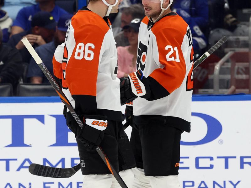 Nov 7, 2024; Tampa, Florida, USA; Philadelphia Flyers center Scott Laughton (21) and left wing Joel Farabee (86) talk against the Tampa Bay Lightning during the second period at Amalie Arena. Mandatory Credit: Kim Klement Neitzel-Imagn Images