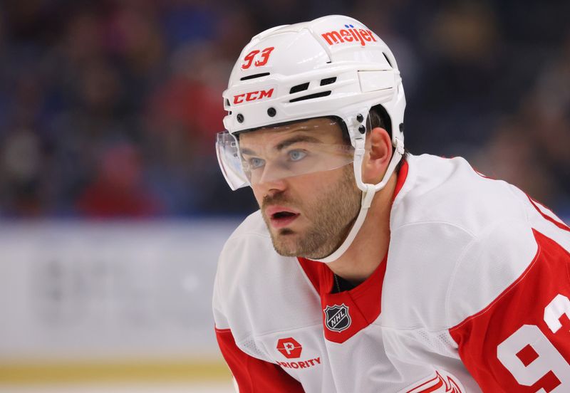 Oct 26, 2024; Buffalo, New York, USA;  Detroit Red Wings right wing Alex DeBrincat (93) waits for the face-off during the first period against the Buffalo Sabres at KeyBank Center. Mandatory Credit: Timothy T. Ludwig-Imagn Images