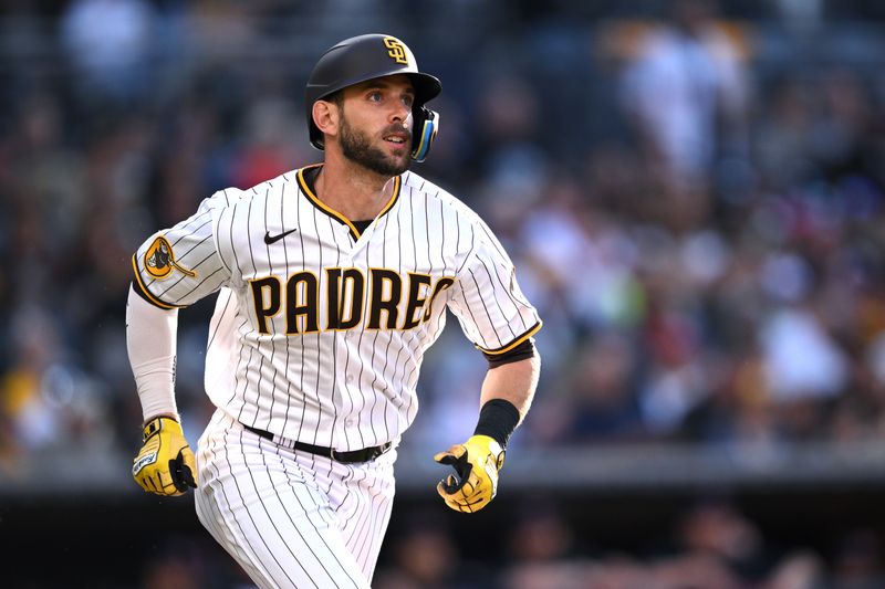 Jun 15, 2023; San Diego, California, USA; San Diego Padres catcher Austin Nola (26) watches his double against the Cleveland Guardians during the second inning at Petco Park. Mandatory Credit: Orlando Ramirez-USA TODAY Sports